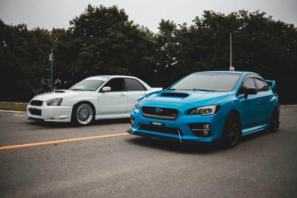 blue and white subaru cars